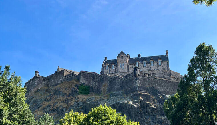 the towering Castle in Edinburgh, Scotland on a sunny day